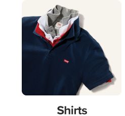 A blue polo with red and white polos inside it, all collars popped. Shop shirts.