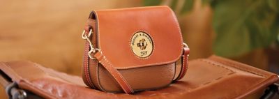Crossbody Bags. Image of brown Dooney & Bourke crossbody bag. 