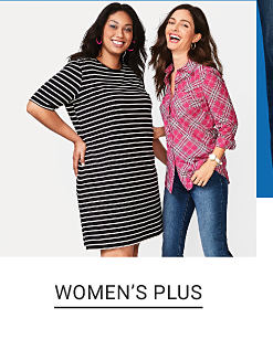  A woman in a black and white stripe dress standing next to a woman in a red plaid top and jeans. Shop women's plus. 