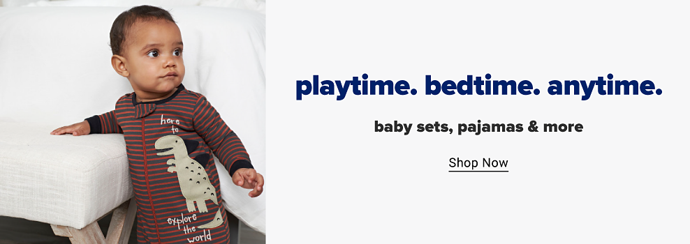 A baby boy wears a red and black striped onesie with footies featuring a dinosaur graphic and zip closure. Playtime. Bedtime. Anytime. Baby sets, pajamas and more. Shop now.