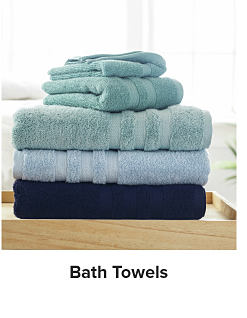 A stack of folded towels. Shop bath towels.