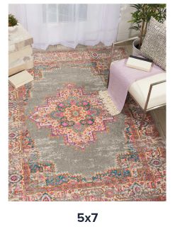 A rug with a decorative design in red, teal and white. Shop 5 by 7 rugs.