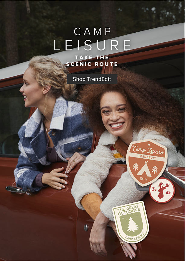 Image of women looking out car window in plaid jacket Camp Leisure Take the scenic route Shop TrendEdit