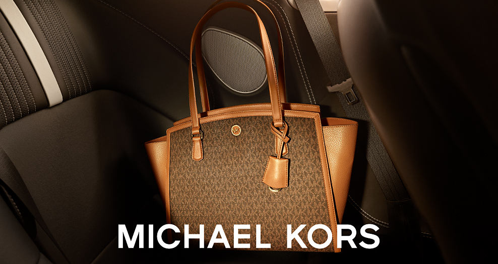 Brown leather handbag with logo pattern. Michael Kors. 