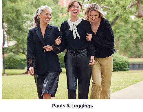 Image of three women wearing black tops and pants. Shop pants and leggings.