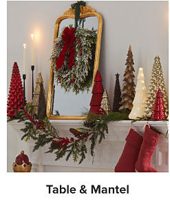 A mantlepiece with Christmas decor. Shop Table and Mantle.