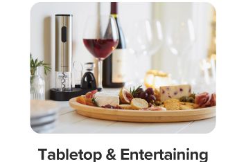 A charcuterie board and wine glasses. Shop tabletop and entertaining.