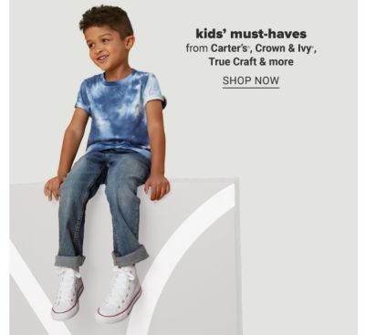 A boy in a blue and white tie dye, jeans and white sneakers. Kids' must haves from Carter's, Crown and Ivy, True Craft and more. Shop now.