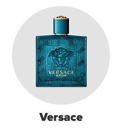 An ornate blue bottle of Versace cologne. Versace. 