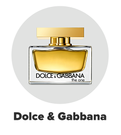 A short, clear bottle of Dolce and Gabbana perfume. Dolce and Gabbana. 