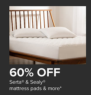 Wooden bedframe with foam mattress and pillows. 60% off Serta and Sealy mattress pads and more.