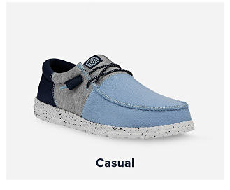 A blue Hey Dude shoe. Shop casual. 