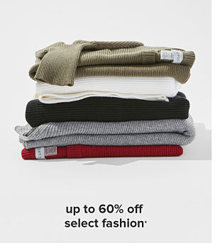 A stack of folded sweaters in green, white, black, gray and red. up to 60% off select fashion. 