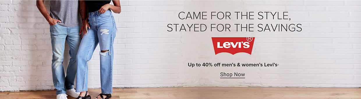 A man and a woman wearing Levi's jeans and tee shirts. Came for the style, stayed for the savings. The Levi's logo. Up to 40% off men's and women's Levi's. Shop now.