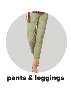 A woman wears olive green pants. Shop pants and leggings.