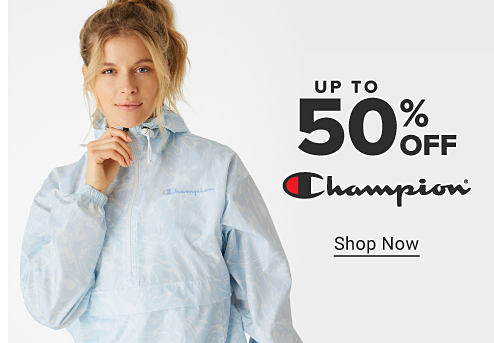 A woman in a white Champion jacket. Up to 50% off Champion. Shop now. 