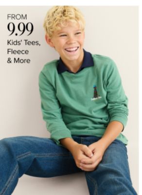 From 9.99 kids tees, fleece and more. Shop now. A kid in a green sweater and blue jeans.