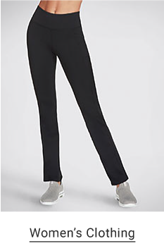 A woman wears black active pants paired with gray slip-on sneakers. Shop women's clothing. 