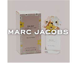 A perfume bottle next to a pink box. Shop Marc Jacobs. 