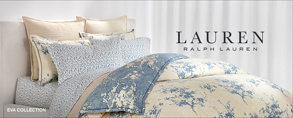 Lauren Ralph Lauren. An image of a bed with blue and white bedding. Eva collection