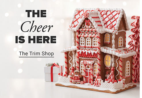 The cheer is here. Image of gingerbread house. The Trim Shop.