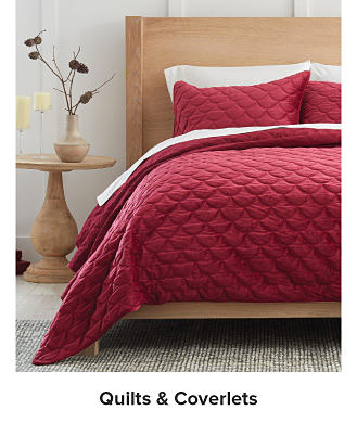 Image of bed. Shop quilts and coverlets.
