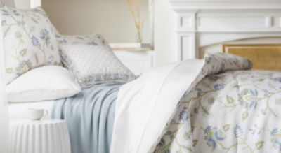 A blue and white bedding set. Shop bed and bath.