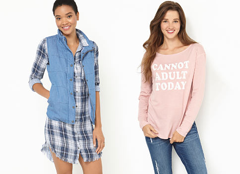 A young woman wearing a multi-colored plaid button-front shirt, a denim vest & beige pants standing nest to a young woman wearingdistressed blue jeans, navy sneakers & a light pink "Cannot Adult Today" long-sleeved graphic tee. Young contemporary tops. Shop now. 