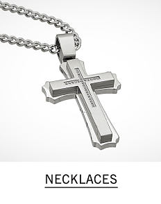 A silver tone cross pendant necklace. Shop men's necklaces.