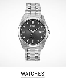 A silver tone men's watch with a black dial. Shop men's watches.