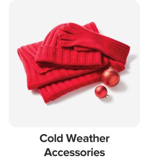 Image of red gloves, a red beanie and scarf. Cold weather accessories.