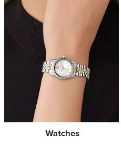 Image of a silver watch. Watches.