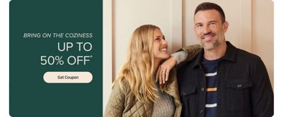 An image of a man and woman wearing cozy outerwear. Bring on the coziness. Up to 50% off. Get coupon.