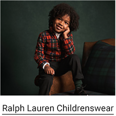 A kid wearing a red and green plaid top with green pants. Ralph Lauren Childrenswear. 