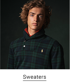 A man with a green and navy blue plaid top. Sweaters.