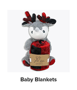 A stuffed reindeer and red buffalo check blanket. Shop baby blankets.