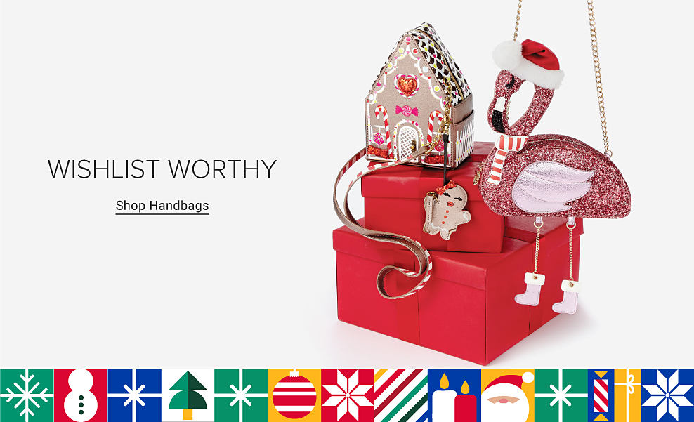 Flamingo and gingerbread house shaped accessories on top of red gift boxes. Wishlist worthy. Shop handbags.