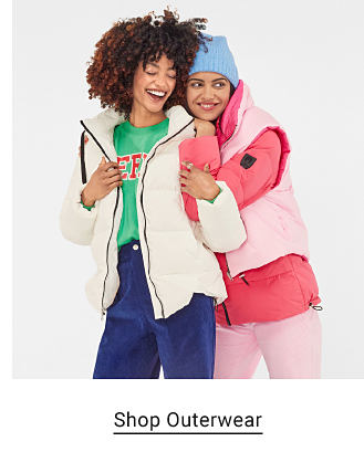 Two women wearing winter coats. Shop outerwear