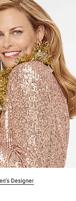 A woman in a sparkly top with a gold feather boa. Shop women's designer. 