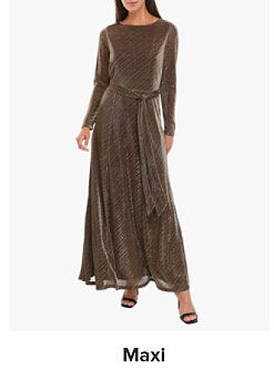 An image of a woman wearing a long sleeve maxi dress. Shop maxi dresses. 