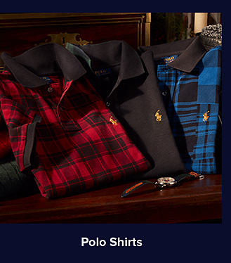 An image of a red plaid-printed polo shirt, a solid black polo shirt, and a blue plaid-printed polo shirt. Shop polo shirts.