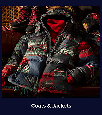An image of a colorful multi-printed puffer jacket. Shop coats and jackets.
