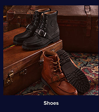 An image of a pair of black boots and a pair of brown leather boots. Shop shoes.