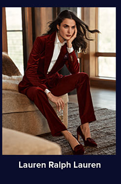 An image of a woman in a burgundy suit with a white shirt and burgundy heels. Shop Lauren Ralph Lauren.