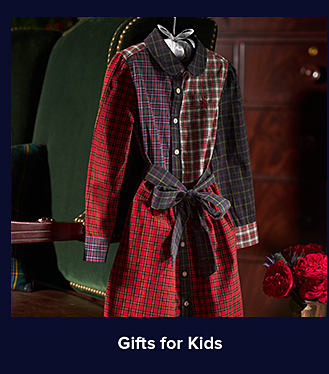 An image of a multi-printed button-down shirtdress. Shop gifts for kids.