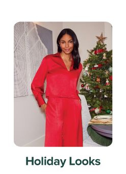 An image of a woman wearing a red outfit. Holiday glam shop.