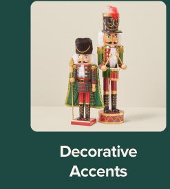 An image of two nutcrackers. Decorative accents.