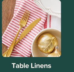 An image of a table set with table linens. Table linens.