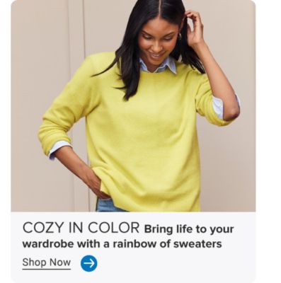 Image of woman in bright sweater. COZY IN COLOR. Bring life to your wardrobe with a rainbow of sweaters. Shop Now. Arrow icon.