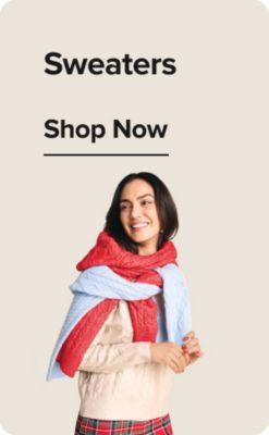 Pants. Shop now. A woman wearing red plaid pants in black heels shoes.